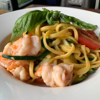 Homemade linguini with shrimp, zucchini, cherry tomatoes, garlic & olive oil.