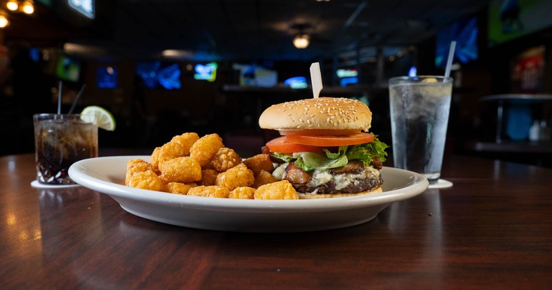 Bleu Cheese Burger with tater tots and drinks