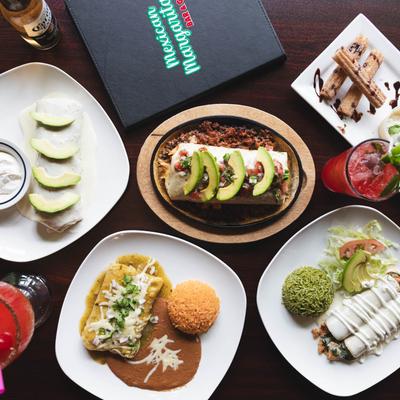 A spread of various Mexican dishes and drinks.