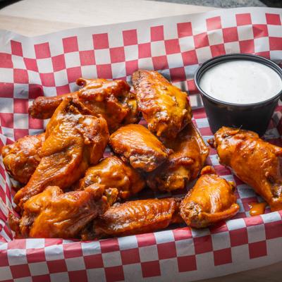Buffalo wings with creamy dipping sauce.