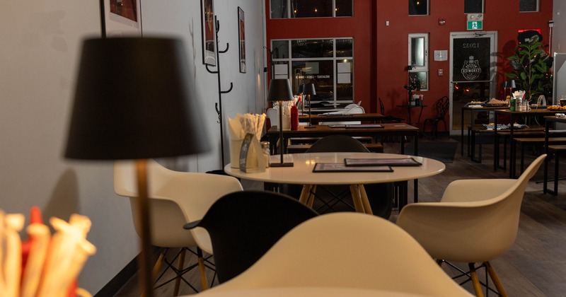 Interior view of a modern restaurant with round tables