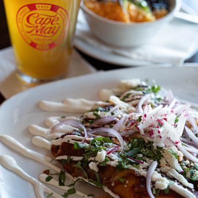 Red enchiladas and a beer.