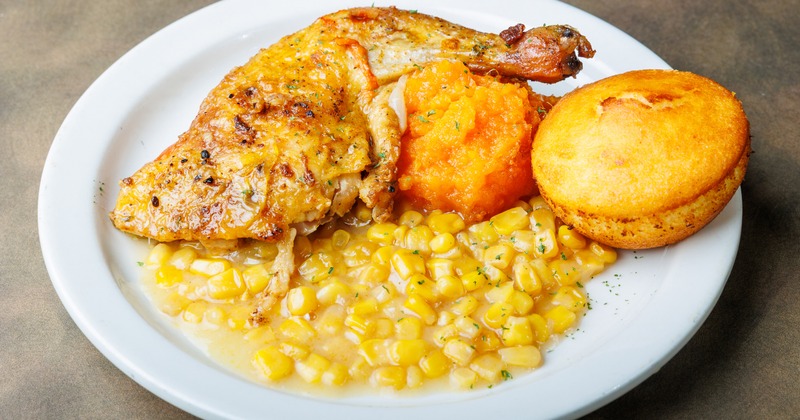 Chicken with cream corn, candied yams, and cornbread