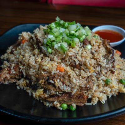 Pork fried rice topped with scallions.