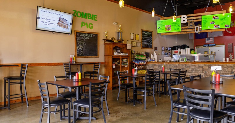 Interior, dining area, TVs on the walls