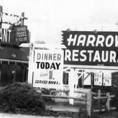 Black and white picture of various signs for Harrow's Restaurant.