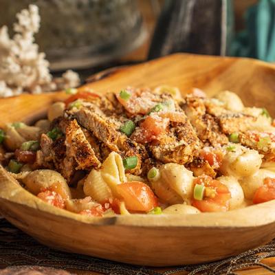 Blackened Chicken Pasta, with Alfredo sauce, diced tomatoes, and chives.