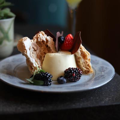Panna cotta topped with mixed berries.