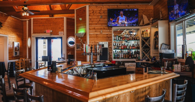 Bar, tv screen above the drink rack