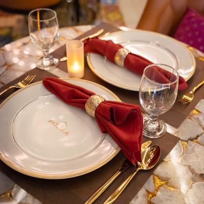 Plates, utensils, napkins, and glasses.