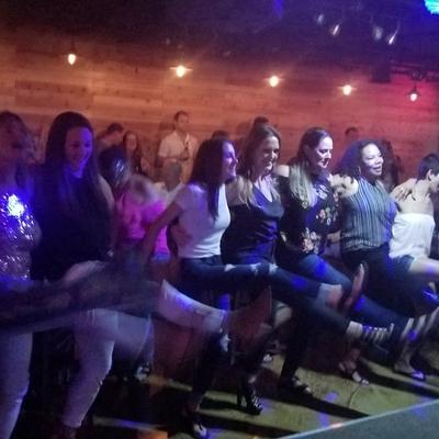 Interior, people dancing.