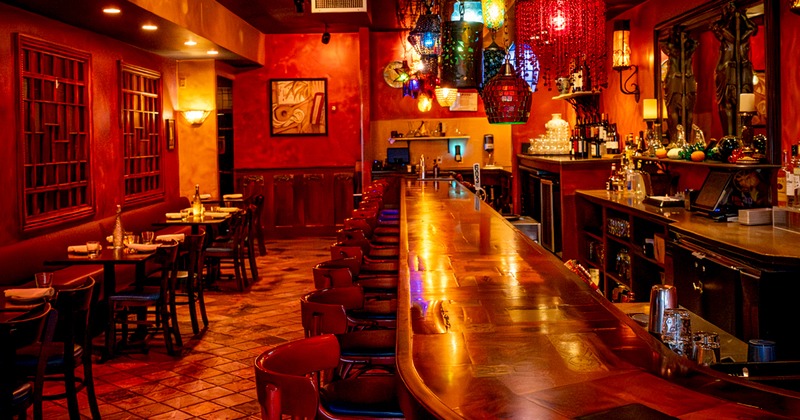 Bar area, bar, stools, tables, chairs