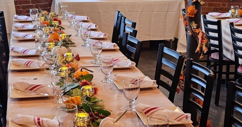Nicely set dining table with lovely decorations, ready for guests