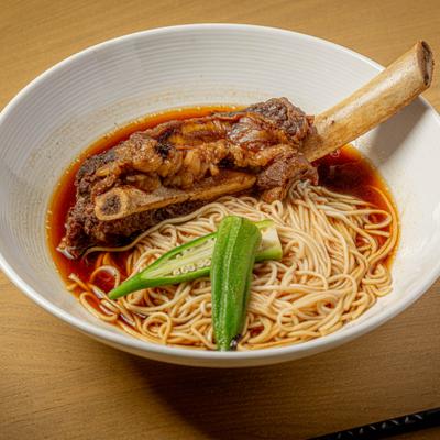 Beef Short Rib Noodle Soup garnished with sliced okra.