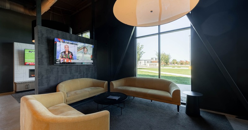 Interior, lounge area with TV on the wall