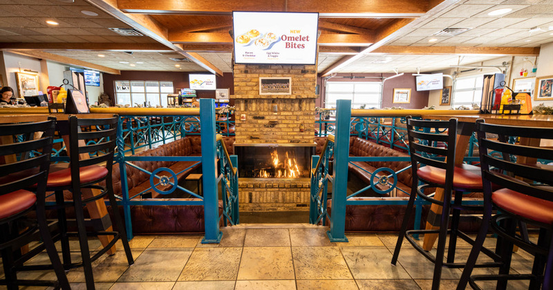 Interior, the fireplace with the  surrounding seating area
