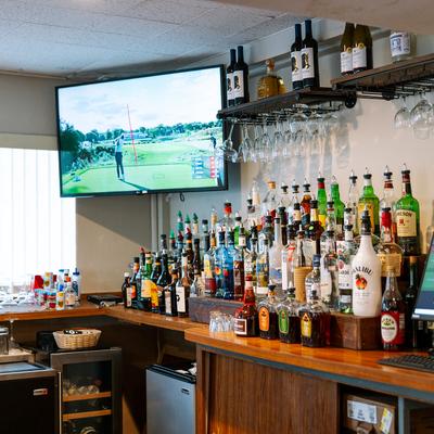 Interior, spirits in the bar with a TV.