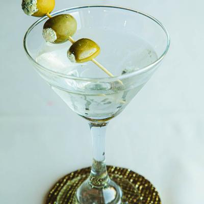 Martini with cheese stuffed olives.