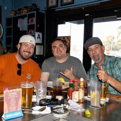 Three guests posing for a photo.