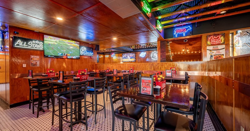 Interior, tables, and chairs with wooden walls and ceiling