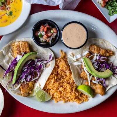 Served tacos on the plate.