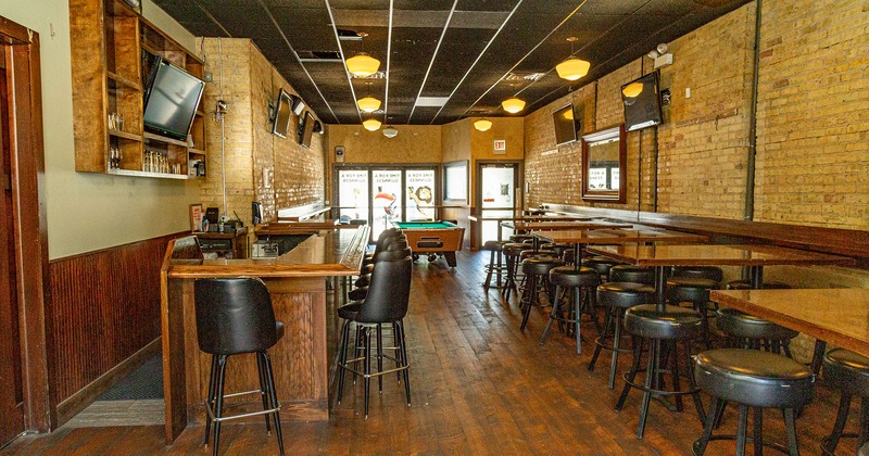 Interior, bar area, seating, tables, pool table and wall TV screens