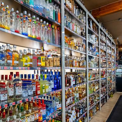 Various liquor bottles on the shelves.