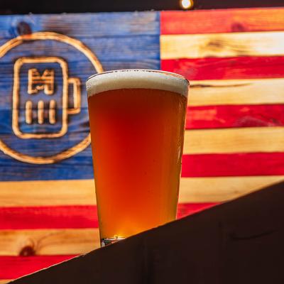 A glass of light beer.