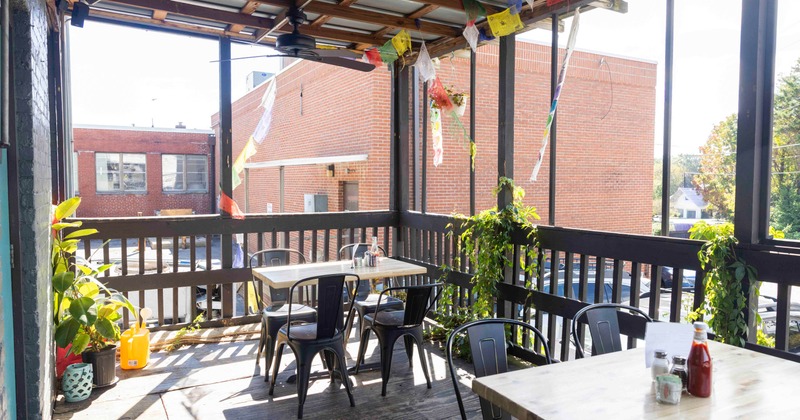 Exterior, patio, covered seating area, tables for four