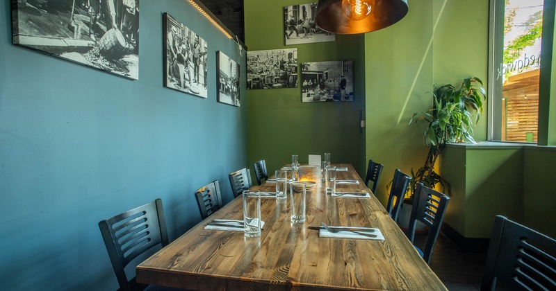 Interior, private dining room, wooden top table for eight, black and white pictures