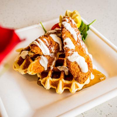 Chicken and Waffles, with maple syrup, and creme fraiche.