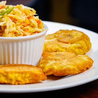 Fried plantains served with pickled slaw.