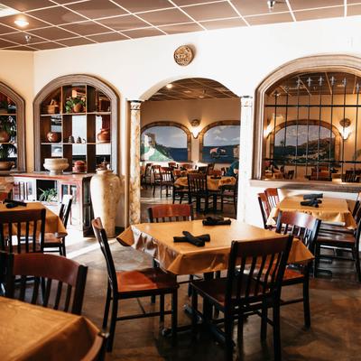 Interior, dining tables ready for guests