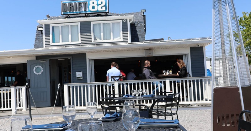 Exterior, diner table close up  on the sand in front the restaurant