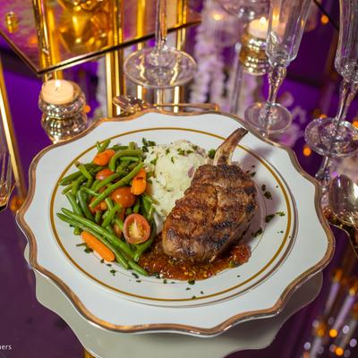 Grilled meat chop served with mashed potatoes and vegetables