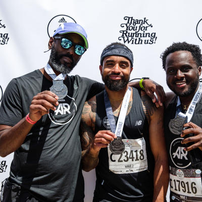 Three guests having fun, posing for a photo.