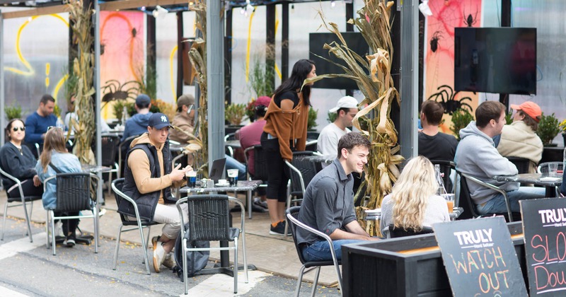 Exterior, patio full of seated guests