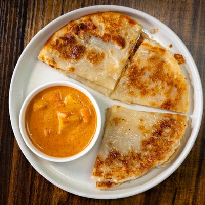 Flatbread served with curry dipping sauce.