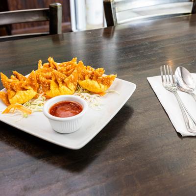 Crispy wontons filled with shrimp and chicken, served with dipping sauce.