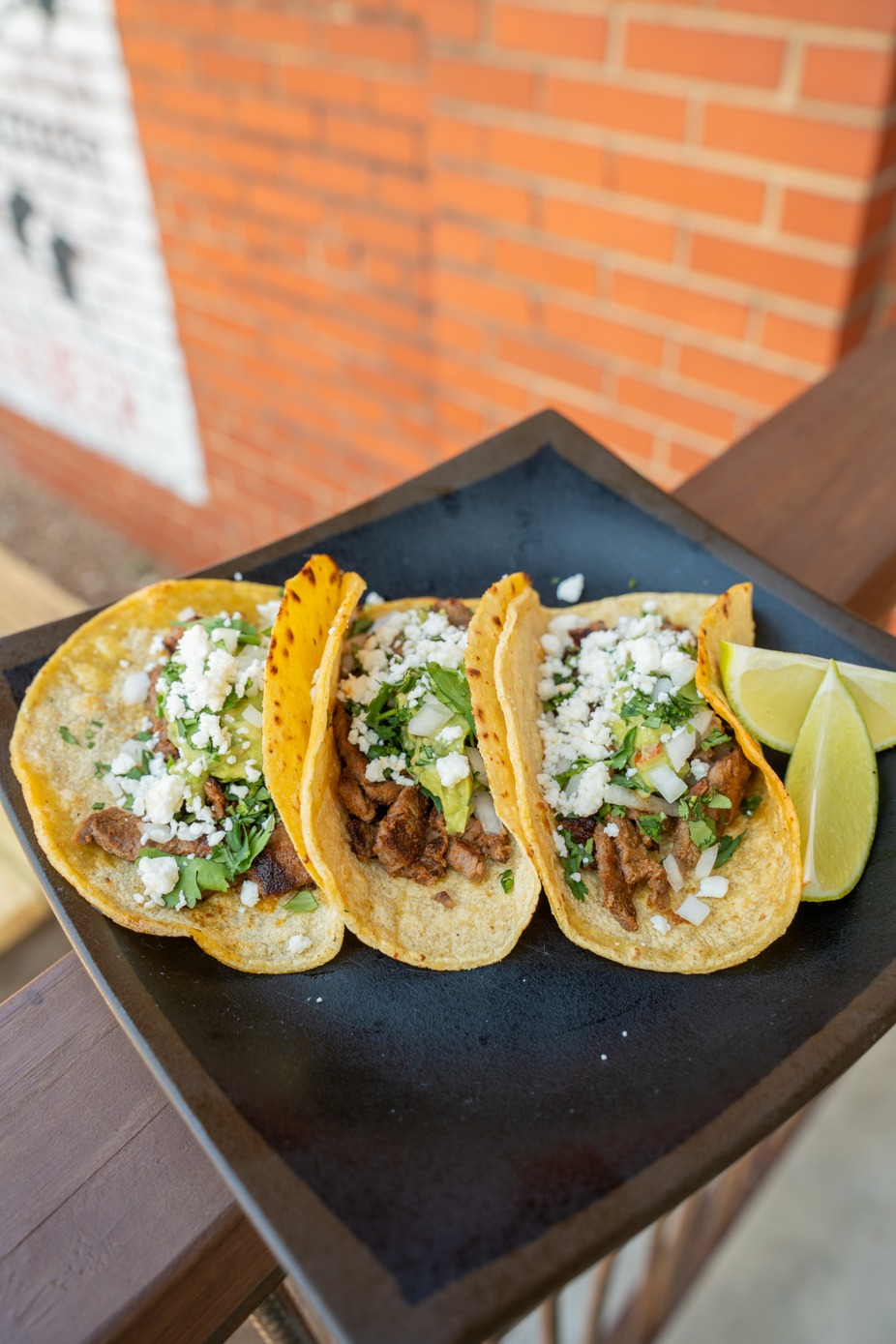 Carne Asada Tacos - Queso Fresco, guacamole, cilantro, onion, carne asada