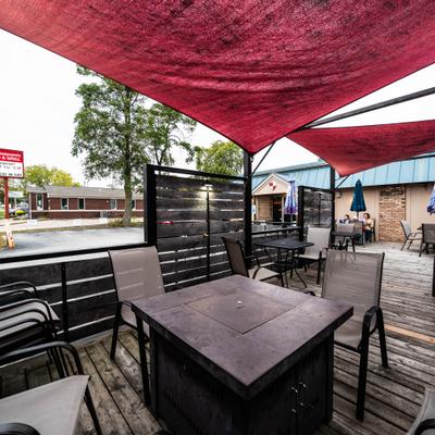 Outside patio with tables and chairs.