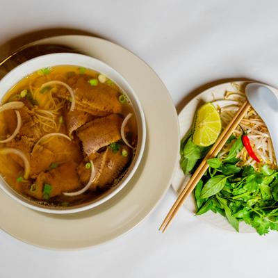 Beef Noodle Soup, with Brisket, served with a side salad.