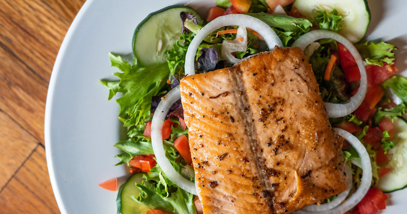 Grilled salmon over Garden salad