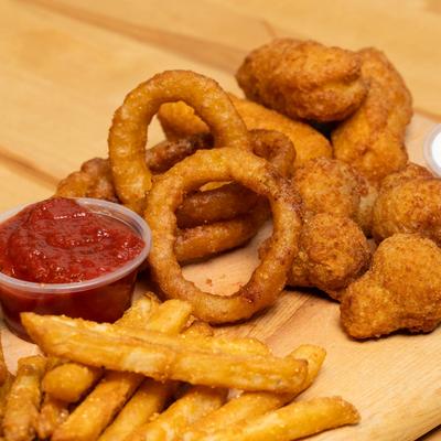 Platter with fried foods and dipping sauces, close up.