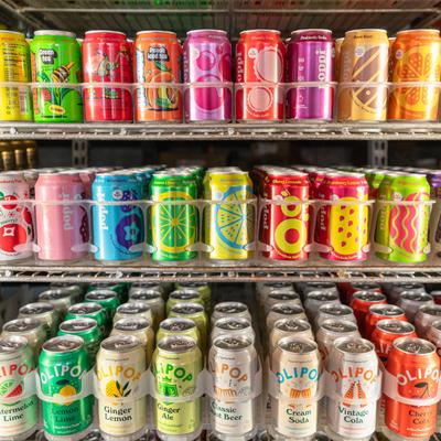 Assorted canned soft drinks in the store.