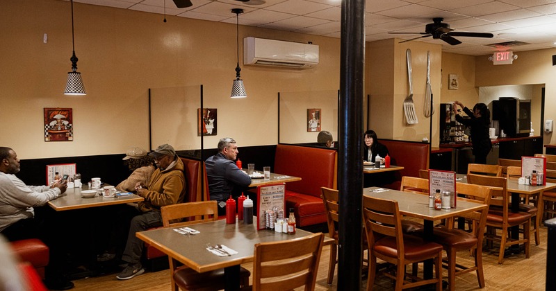 Diner room, booths, tables and chairs, guests