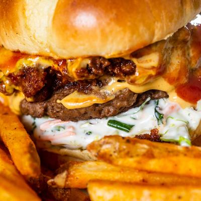 A close up of the Backyard Burger and fries