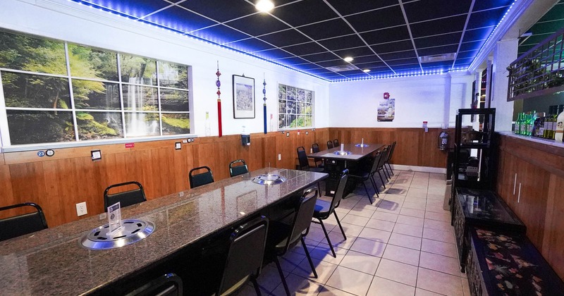 Interior, tables and chairs in dining area