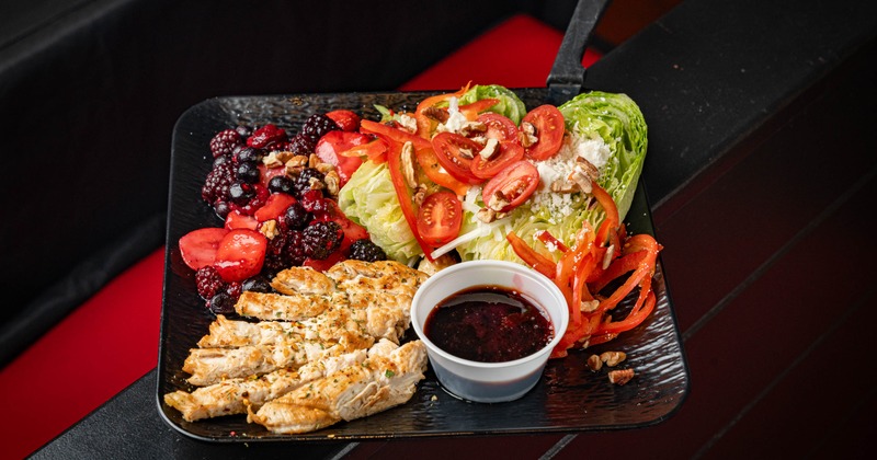 Berry Wedge Salad with chicken, mixed berries ,feta and tomato