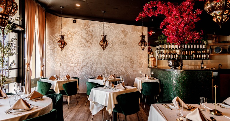 Interior, tables and chairs in dining area near the bar